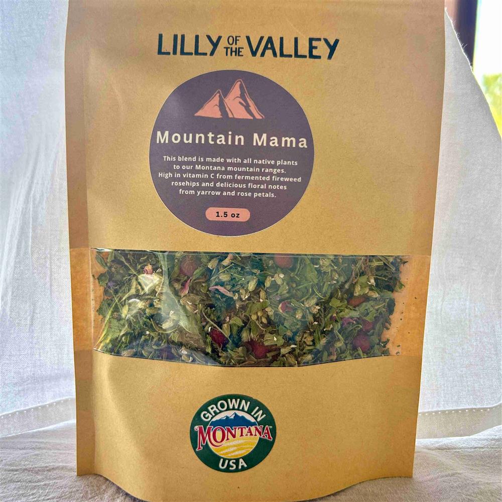 A Lilly of the Valley Mountain Mama tea pouch with dried leaves visible.