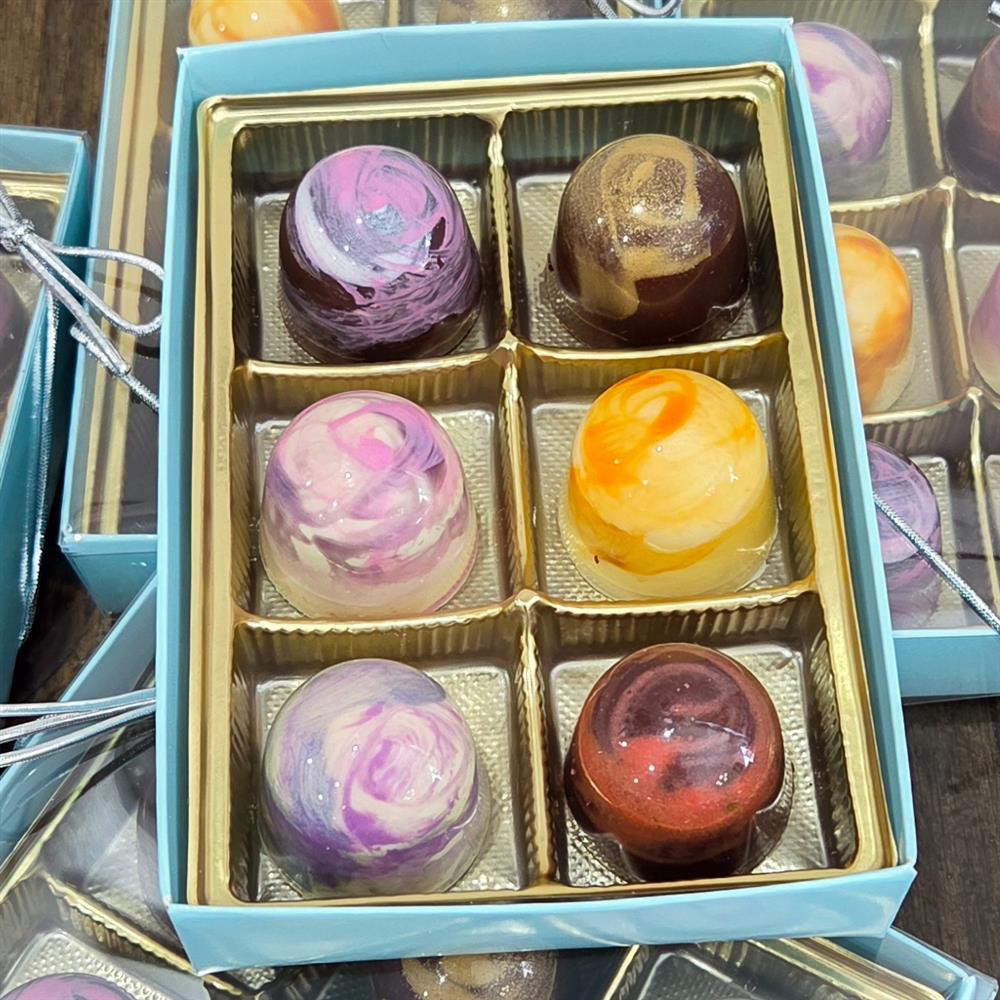 Colorful bonbons in a divided gift box