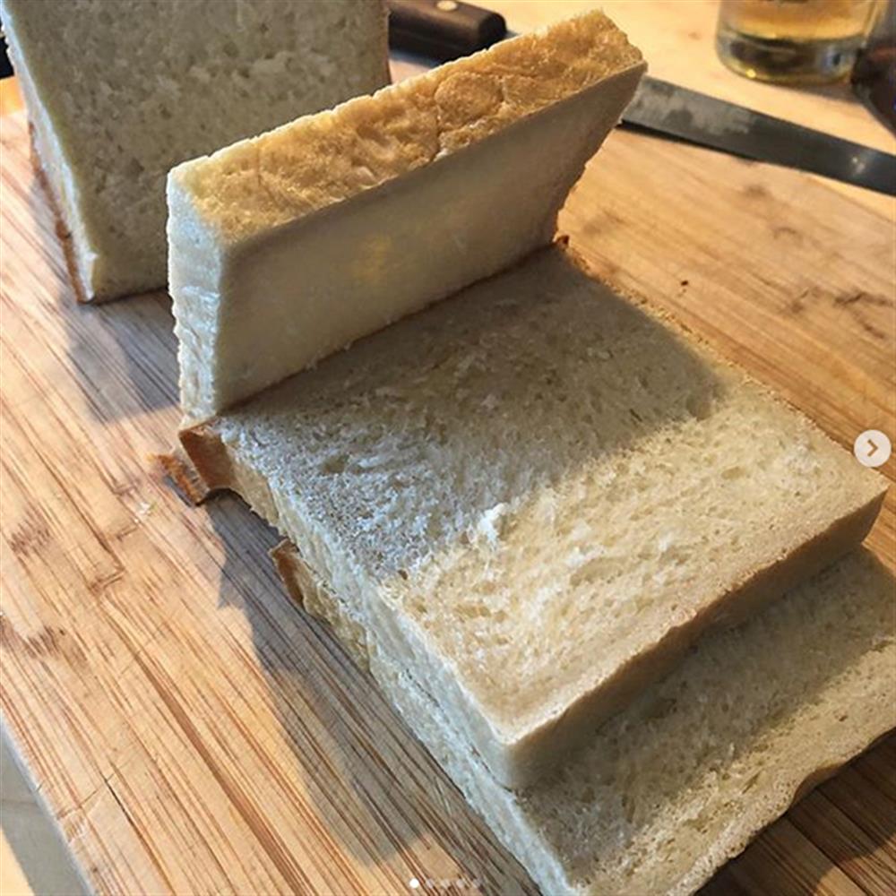 Sliced milk bread on a wooden board