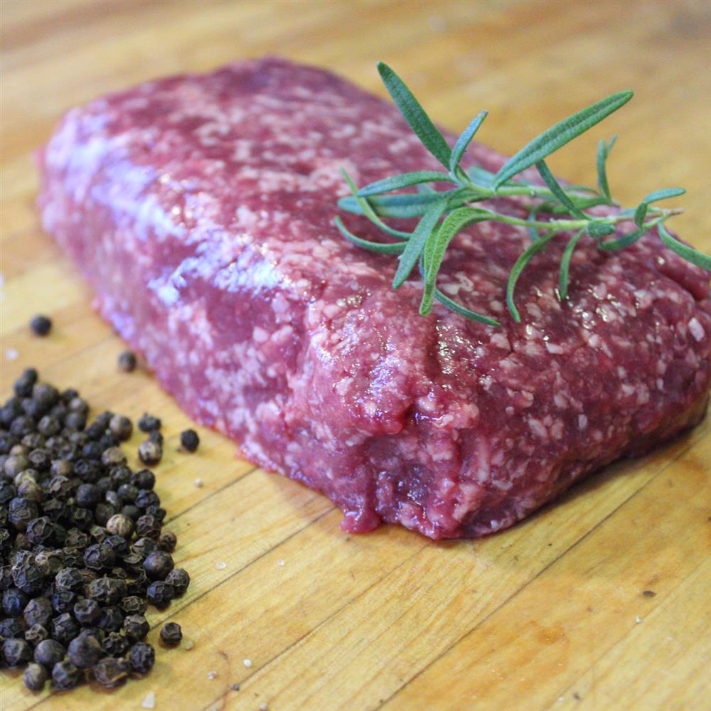 Ground beef on a wooden board