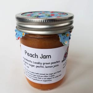 A jar labeled Peach Jam.