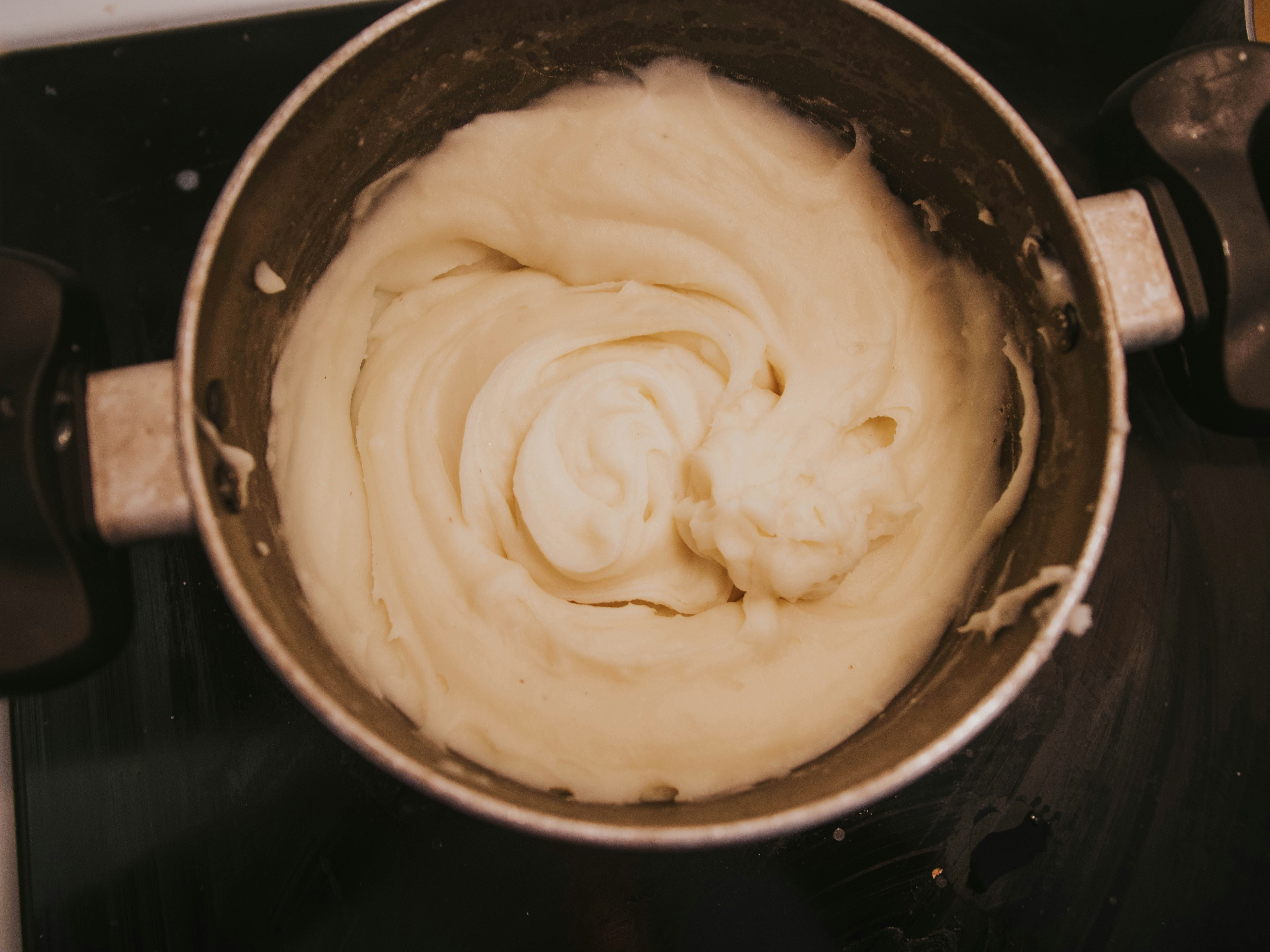 Ingredient illustration: prepared mashed potatoes in a saucepan, not the finished lentil pie.
