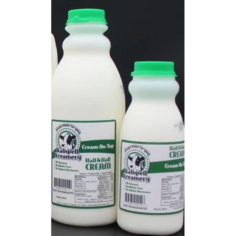 Two bottles of Kalispell Kreamery half-and-half with green caps.