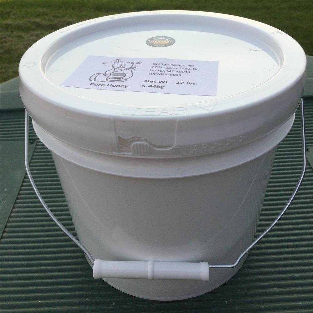 White bucket of honey