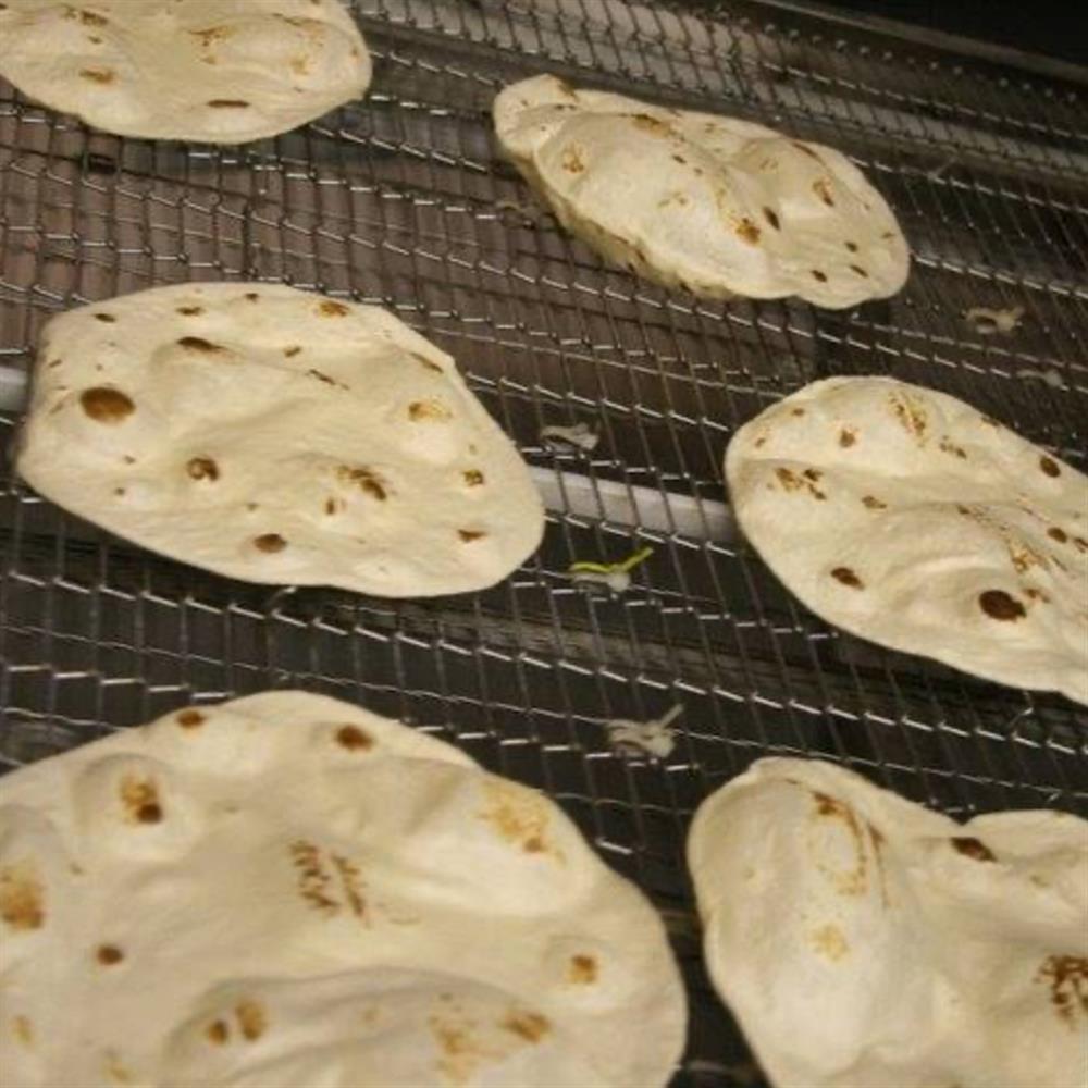 Tortillas cooling on racks